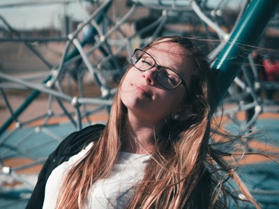 young person laying back relaxing