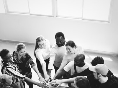 group of people hands in centre